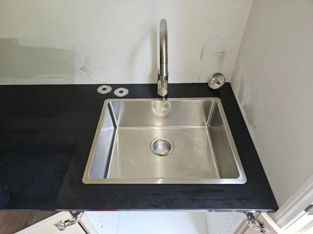 Stainless steel sink installation with mixer tap by NG Trade Solutions