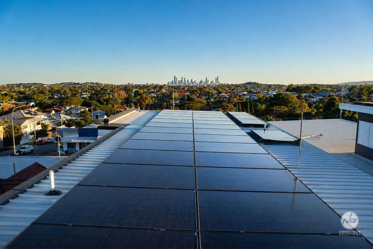Rooftop solar array with city skyline