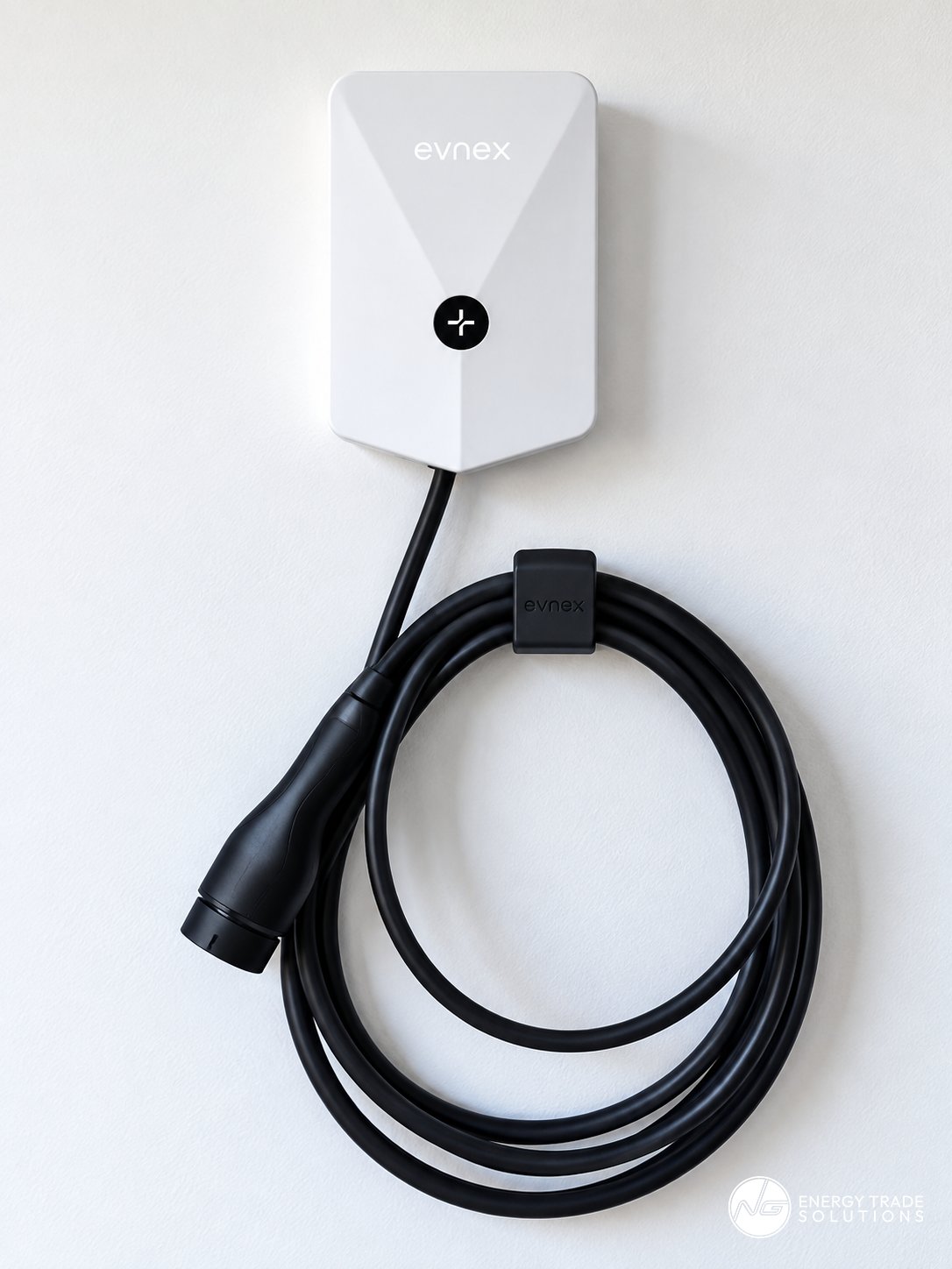 White Evnex electric vehicle charger with coiled charging cable.